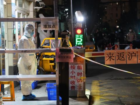 Shanghai healthcare worker at night wearing full PPE