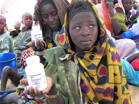 Women in Mali with bottles of antibiotics