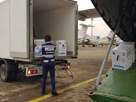 Loading COVID vaccine onto truck at airport