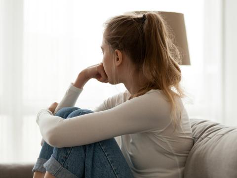 Lonely girl on couch