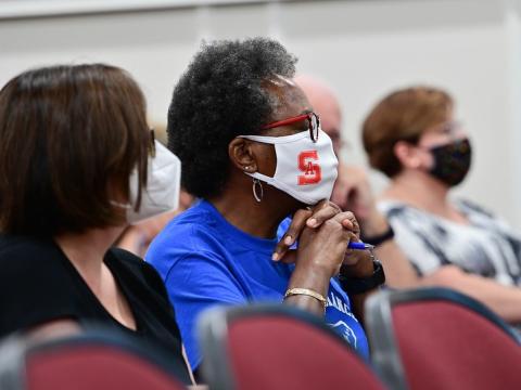 Women in meeting wearing masks
