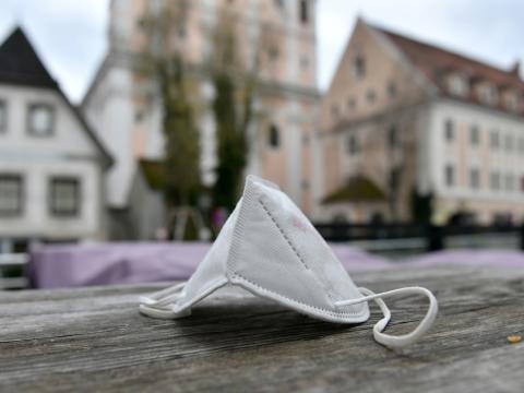 Mask on street table in Austria
