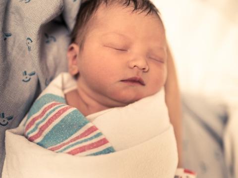 Mom holding newborn