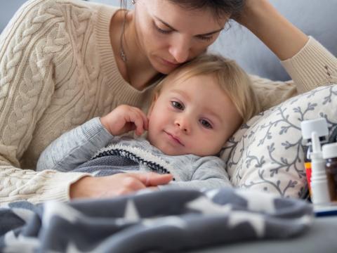 Mom in bed with sick kid