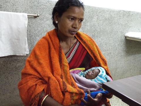 Mother holding baby who has sepsis