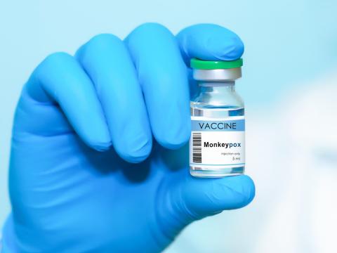 Monkeypox vaccine vial in gloved hand