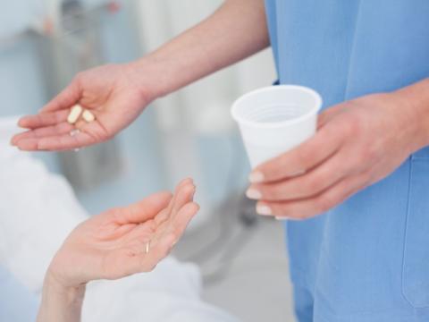 Nurse dispensing pills