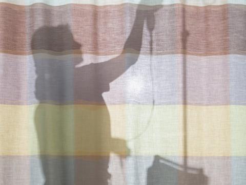Nurse silhouette on curtain