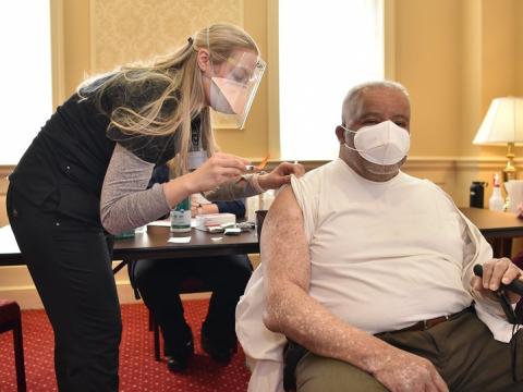 Older man getting COVID vaccine
