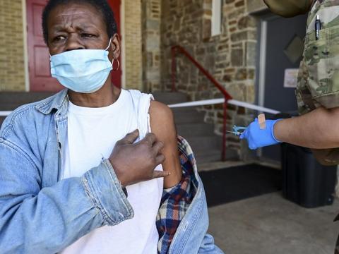Older man getting COVID vaccine