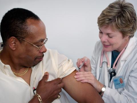 Older man getting vaccinated