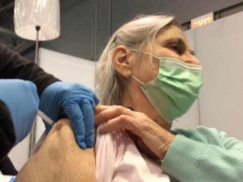 Older woman getting COVID shot