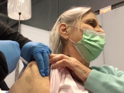 Older woman getting COVID vaccine