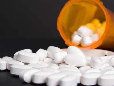 Pills spilling from bottle