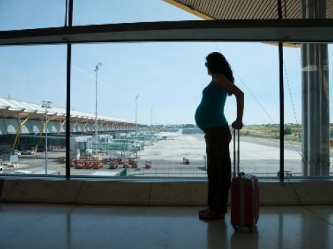 Pregnant woman at airport