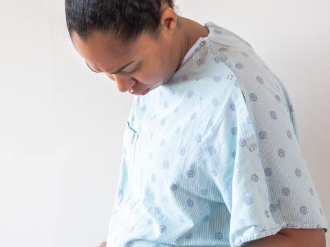 Pregnant woman in hospital gown