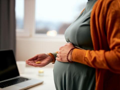 Pregnant woman taking pills