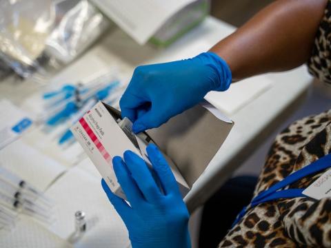 Vaccinator with wipes and syringes