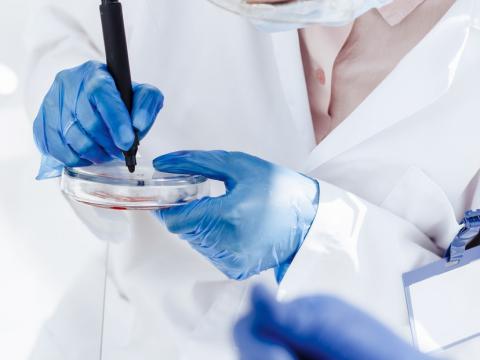 Scientist with petri dish