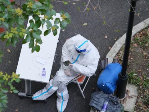 Health worker guarding building in Shanghai