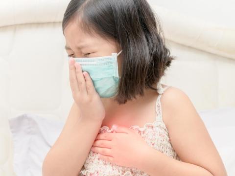 Sick Asian girl with medical mask