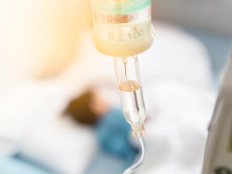 Sick child hooked up to IV fluids