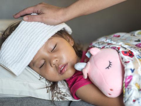 Sick little girl in bed
