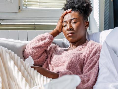 Sick woman on couch