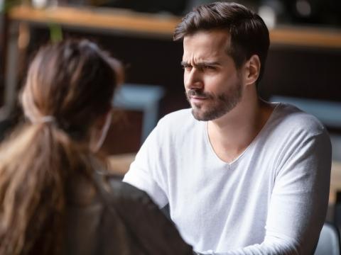 Skeptical man with woman