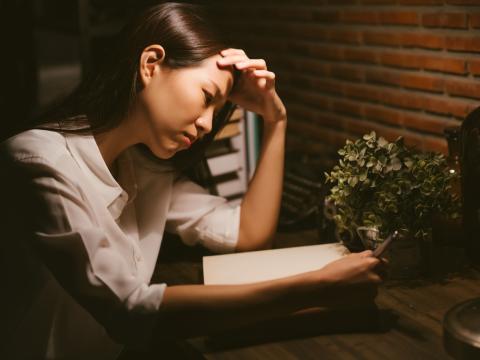 Stressed girl studying at home