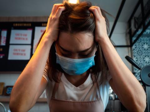 Stressed coffee shop worker