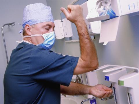 Surgeon washing hands