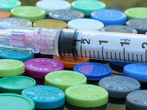 Syringe on vials