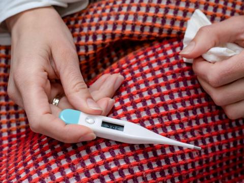 Thermometer on blanketed lap