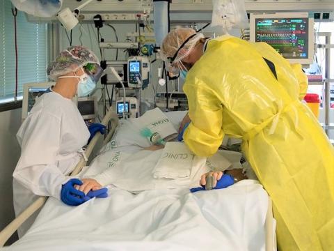 Doctor and nurse treating COVID patient
