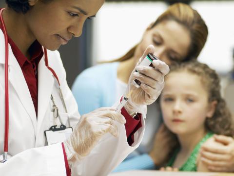Child awaits vaccination