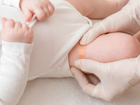 Vaccine band-aid on baby