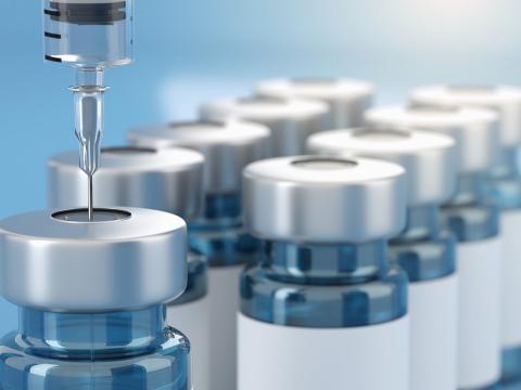 Vaccine vials and syringe