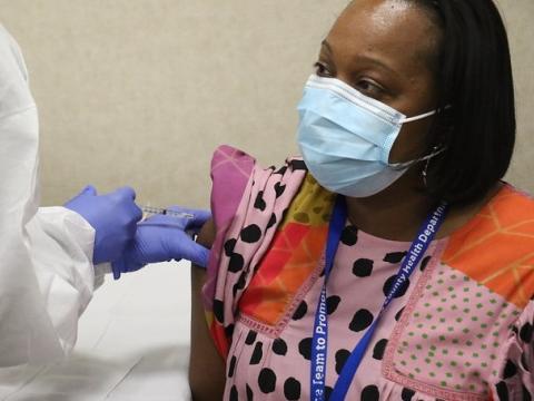 Woman gettnig COVID vaccine