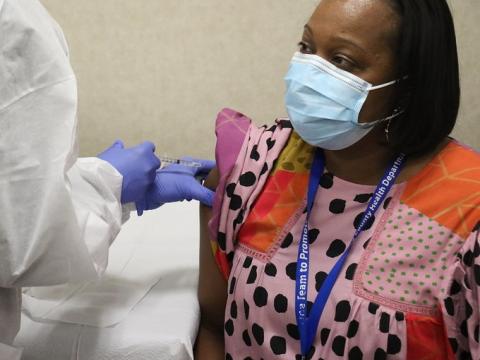Woman receiving COVID vaccine