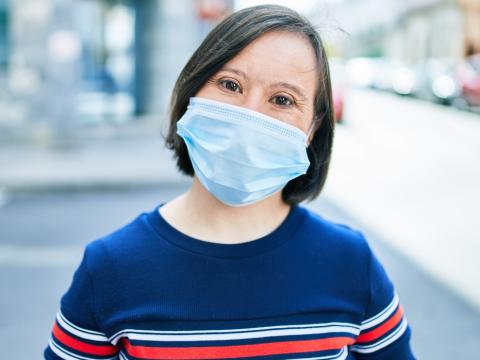 Woman with Down syndrome wearing mask