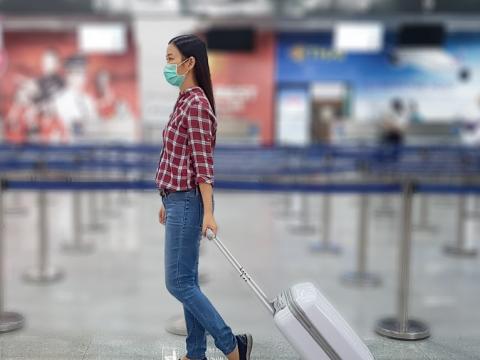 Woman with luggage in airport