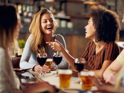 Young adults dining indoors without masks