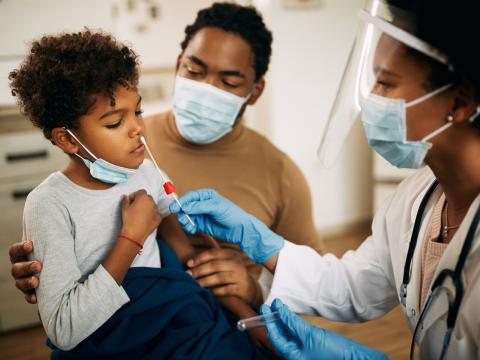 Young boy getting nasal swab