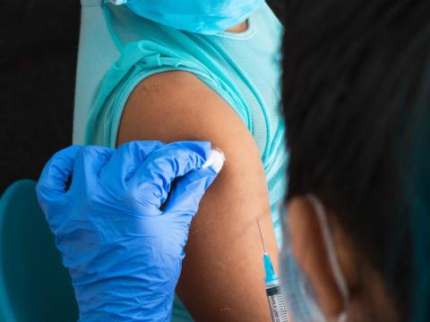 Young girl getting shot in arm