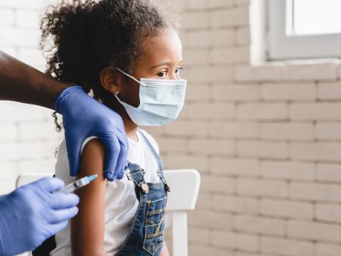 Young girl getting vaccinated