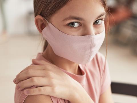 Young girl getting vaccine