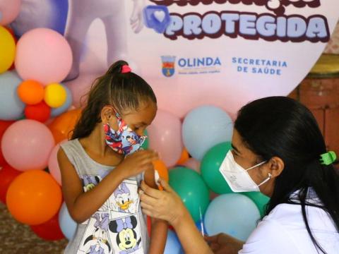 Young girl getting vaccinated