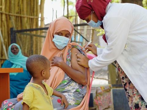 Young mom getting COVID vaccine