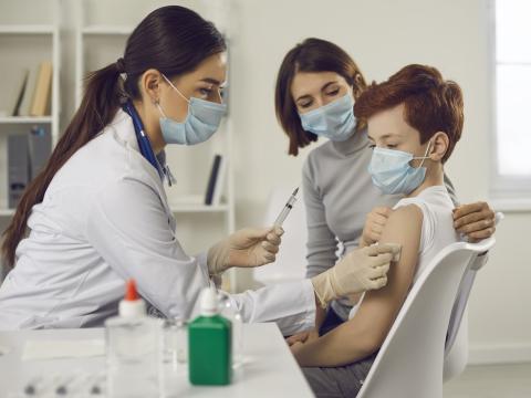 Young teen getting vaccinated